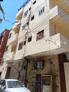 a building with a car parked in front of it at City Hotel in Luxor