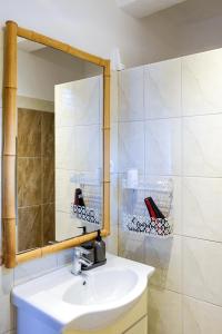 a bathroom with a sink and a mirror at Apartment Stella in Vis +23 photos