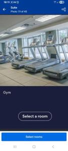a screenshot of a gym with a phone to select a room at Dorado Del Mar Beach Resort in Dorado