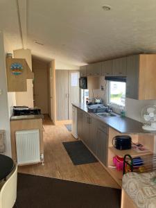 a kitchen with a sink and a counter top at Julie's in Ingoldmells