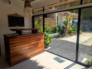 an open door to a patio with a sign on it at Maison PAYAPA PORT BARTON in San Vicente +22 photos