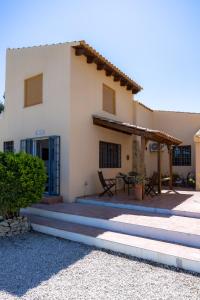 a house with stairs leading to the front of it at Casa Sabor de la Vida in Abarán