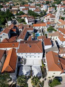 an aerial view of a city with buildings at Torretta Palace Hotel in Turanj