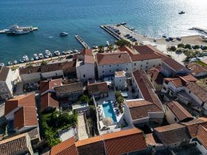 an aerial view of a town next to the water at Torretta Palace Hotel in Turanj