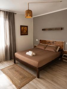 a bedroom with a large bed in a room at Green House in Llagostera +20 photos