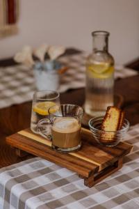 a wooden tray with drinks and bread on a table at Green Garden Plitvice lakes in Plitvica Selo +93 photos