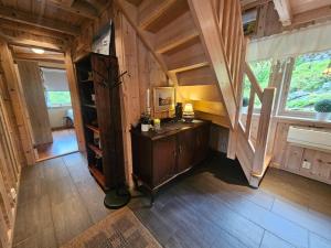 a room with a desk and a staircase in a cabin at Huset ved Dalsfjorden in Helle +26 photos