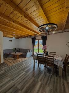 a living room with a table and a couch at Vlasic Odmor - Villa Krajina II in Vlasic