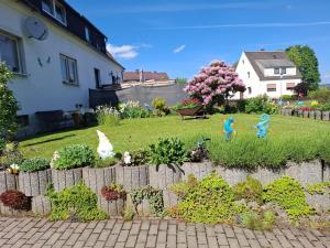 a garden with some toy figurines in a yard at Ferienwohnung Heidi in Selb +10 photos