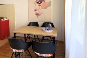 a dining room with a table and four chairs at Boho Apartments in Trebinje