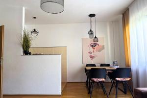 a dining room with a table and chairs at Boho Apartments in Trebinje