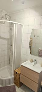 a bathroom with a sink and a tub and a mirror at Accommodation Huljić in Hvar +23 photos