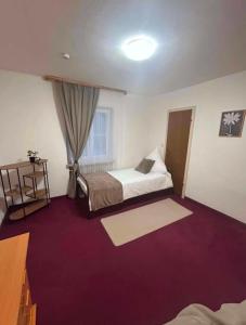a hotel room with two beds and a window at Adriaapartman in Bad Wörishofen