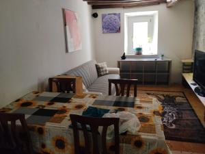 a living room with a table and a couch at Golden horses in Montebabbio