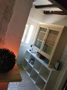 a bathroom with a cabinet and a window at Golden horses in Montebabbio