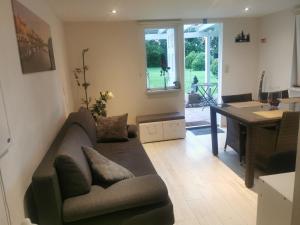 a living room with a couch and a table at Ferienhaus Congolo in Lontzen