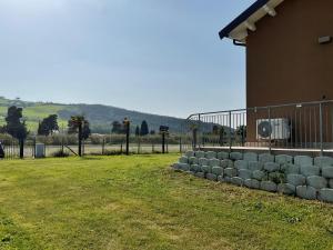 a row of hay bales in a yard next to a building at Oasi Frontemare Appartamenti in Pineto +14 photos