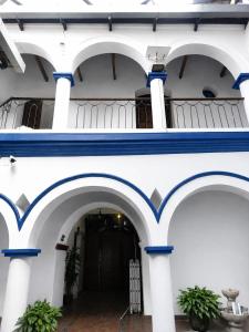a building with blue and white columns at B&B Recoleta in Sucre