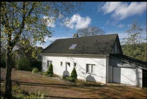 a white house with a black roof at Val du Roannay in Stavelot