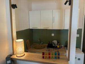 a bathroom with a sink and a tub in a room at Budva Apartment with Private Parking in Budva