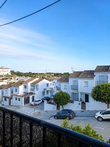a view of a parking lot with white buildings at Casa Nankurunaisa in Vejer de la Frontera