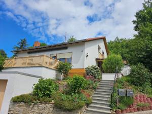 a house with a staircase in front of it at T&G WirthHaus in Bad Rappenau