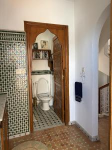 a bathroom with a toilet in a room at Bright Riad with Panoramic Views - Oudayas in Rabat +32 photos