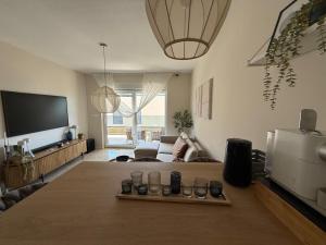 a living room with a couch and a tv at Starview in Privlaka