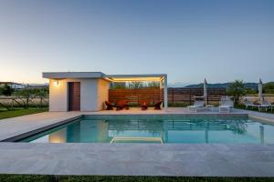 a swimming pool in the backyard of a house at Incanto Toscano in Larciano