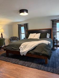 a bedroom with a large bed in a room at The Remington House in Woodruff