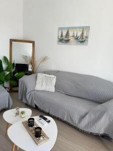 a living room with a couch and a table at Above the Sea - Sparto in Spartos