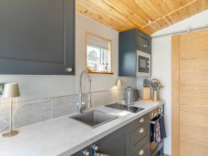 a kitchen with a sink and a counter top at Sky Lark Lodge - Uk49904 in Appley Bridge