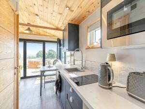 a kitchen with a sink and a counter top at Sky Lark Lodge - Uk49904 in Appley Bridge