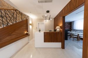 a lobby with a table and a dining room at Hotel Corsaro in Omiš