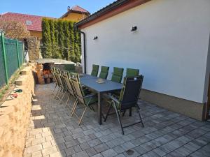 a blue table and chairs on a patio at Chalupa Svratouch36 in Svratouch