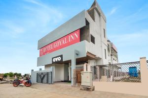 a building with a motorcycle parked in front of it at Hotel O Goyal Inn in Nagpur +21 photos