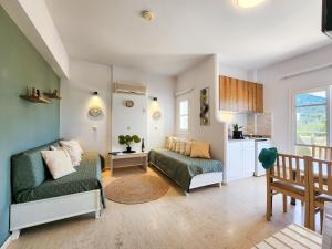 a living room with a couch and a table at Matthew's Place in Malia