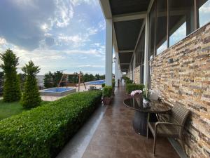 a patio with a table and chairs and a playground at Absheron Marina in Baku