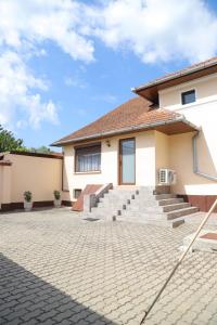 a house with a brick driveway in front of it at Casa Tamplarului in Orăştie