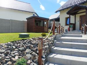 a house with a stone path leading to a house at Letnisko domek z Sauną i Balią in Lubawka +111 photos