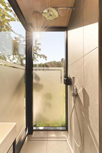 a bathroom with a shower and a glass door at Sûr Jumigny in Jumigny +39 photos
