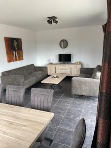 a living room with a couch and a table at LIPNO Hideaway in Kramolín