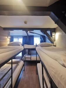 a group of three bunk beds in a room at Hotel Jesse in Amsterdam