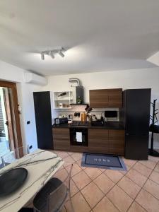 a kitchen with wooden cabinets and a counter top at Casa Amor Iseo Lake in Riva di Solto