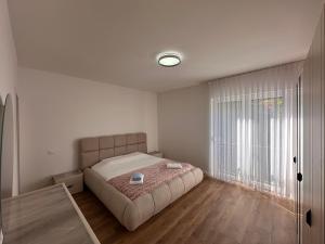 a bedroom with a bed and a large window at Villa Luxury Forest in Peje +75 photos