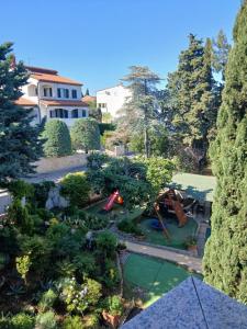 an aerial view of a garden with a playground at Villa Verde Apartments and Rooms in Premantura