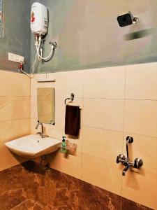 a bathroom with a sink and a mirror at MosesVilla in Jabalpur +22 photos