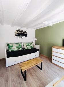 a bedroom with a bed with a van on the wall at Le Patio in Gevrey-Chambertin