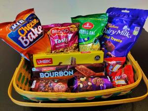 a basket filled with different types of snacks at MosesVilla in Jabalpur