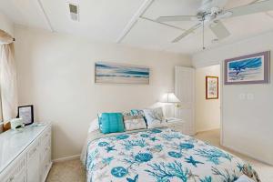 a bedroom with a bed and a ceiling fan at Mallard Lakes - 38082 Mockingbird Ln in Selbyville
